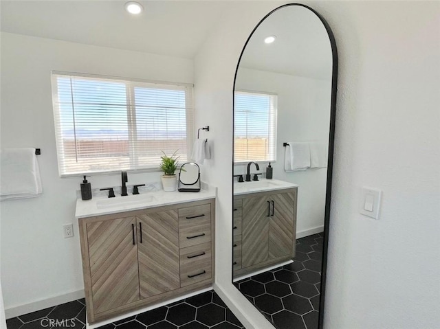 3191 Pearl Springs Ave Unit 29, Palms, CA 92277 - bathroom with two vanities, tile patterned flooring, and recessed lighting