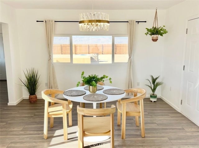 3191 Pearl Springs Ave Unit 29, Palms, CA 92277 - dining room with a chandelier and light wood-type flooring