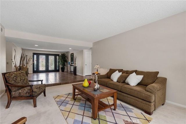 8652 Surrey Ln, Rancho Cucamonga, CA 91701 - living area featuring a textured ceiling, french doors, and light carpet