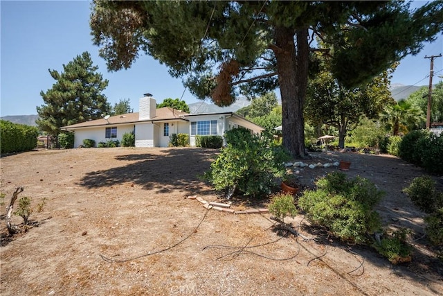 8652 Surrey Ln, Rancho Cucamonga, CA 91701 - view of front facade with a chimney