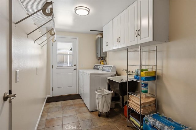 8652 Surrey Ln, Rancho Cucamonga, CA 91701 - laundry area featuring washer and clothes dryer, cabinet space, and water heater