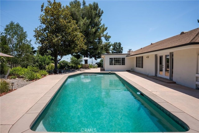 8652 Surrey Ln, Rancho Cucamonga, CA 91701 - outdoor pool with french doors and a patio area