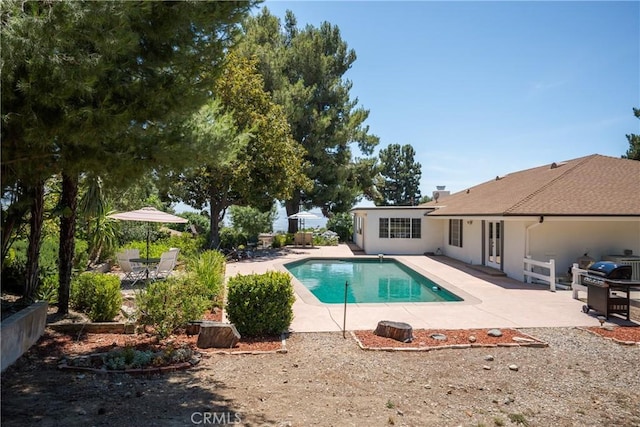 8652 Surrey Ln, Rancho Cucamonga, CA 91701 - view of swimming pool with a patio area