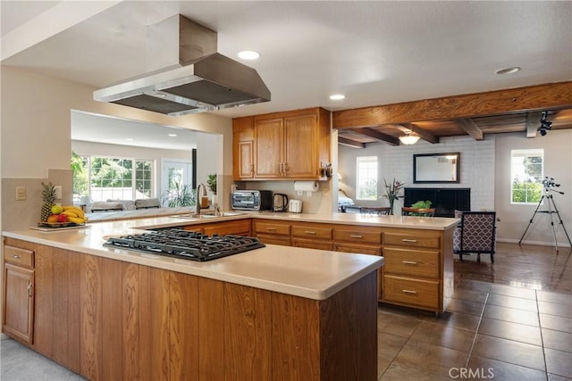 8652 Surrey Ln, Rancho Cucamonga, CA 91701 - kitchen with a peninsula, extractor fan, gas cooktop, plenty of natural light, and beam ceiling
