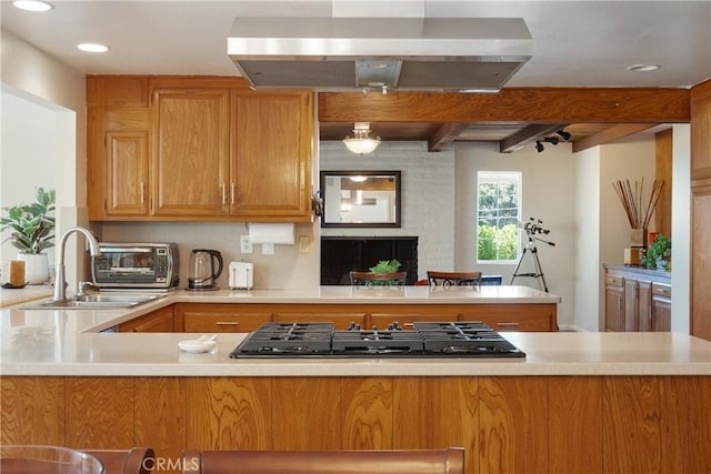 8652 Surrey Ln, Rancho Cucamonga, CA 91701 - kitchen featuring gas stovetop, extractor fan, a peninsula, light countertops, and recessed lighting