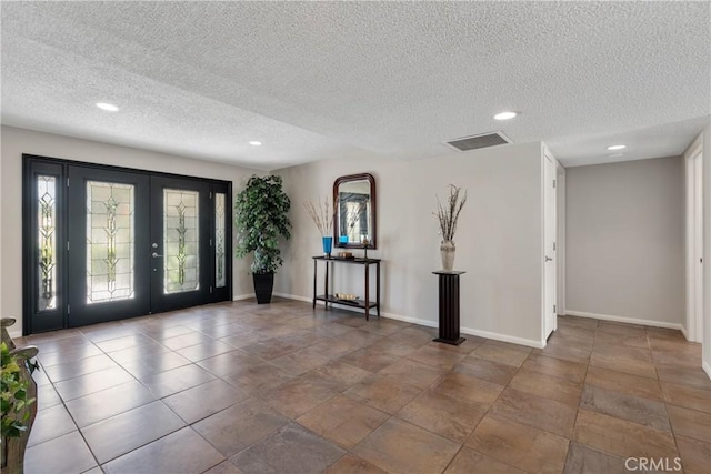 8652 Surrey Ln, Rancho Cucamonga, CA 91701 - foyer featuring french doors, recessed lighting, and a textured ceiling