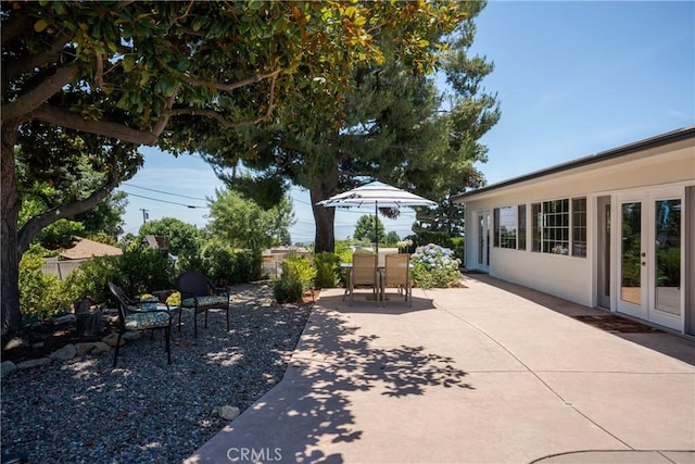 8652 Surrey Ln, Rancho Cucamonga, CA 91701 - view of patio / terrace with french doors and outdoor dining area