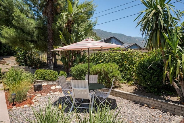 8652 Surrey Ln, Rancho Cucamonga, CA 91701 - view of patio with a mountain view and outdoor dining space