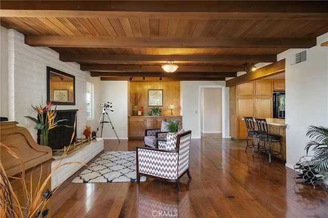 8652 Surrey Ln, Rancho Cucamonga, CA 91701 - living area with a brick fireplace, dark wood-style flooring, and a wooden ceiling with exposed beams