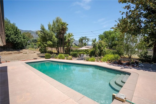8652 Surrey Ln, Rancho Cucamonga, CA 91701 - view of swimming pool with a patio area and a mountain view
