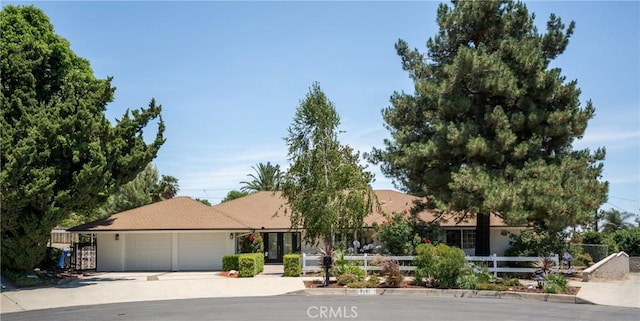 8652 Surrey Ln, Rancho Cucamonga, CA 91701 - view of front facade featuring a garage and concrete driveway