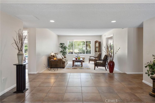 8652 Surrey Ln, Rancho Cucamonga, CA 91701 - living area featuring a textured ceiling, recessed lighting, and tile patterned flooring