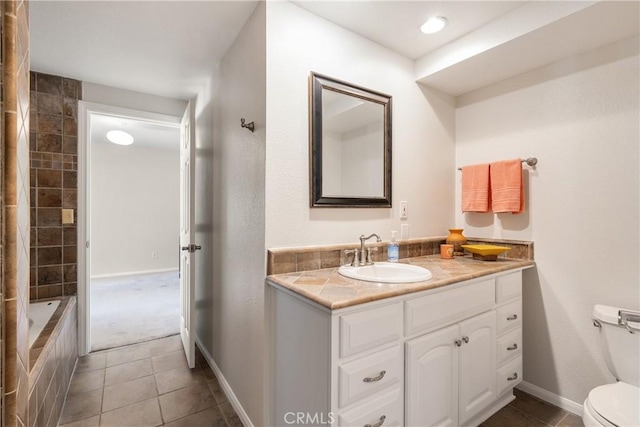8652 Surrey Ln, Rancho Cucamonga, CA 91701 - full bathroom with vanity and tile patterned flooring