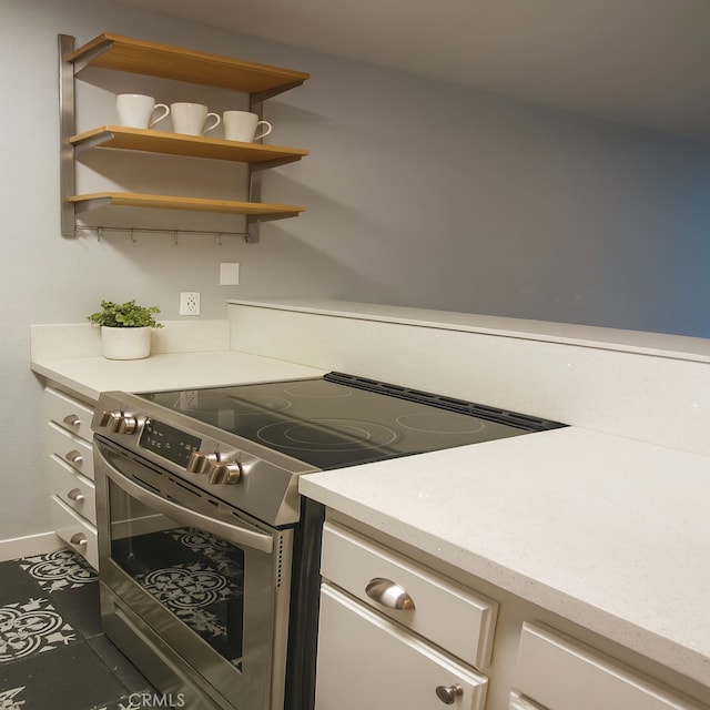 6675 Mission Gorge Rd Unit A114, San Diego, CA 92120 - kitchen with stainless steel range with electric cooktop, white cabinetry, and open shelves