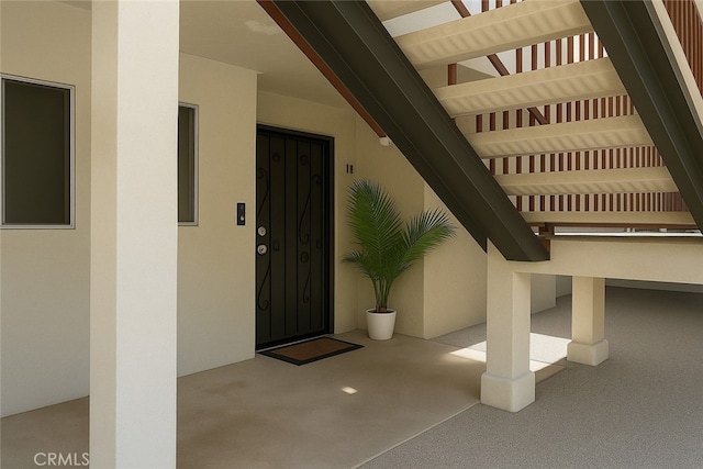 6675 Mission Gorge Rd Unit A114, San Diego, CA 92120 - doorway to property featuring stucco siding and elevator