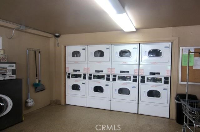 6675 Mission Gorge Rd Unit A114, San Diego, CA 92120 - shared laundry room featuring stacked washing machine and dryer and washing machine and clothes dryer