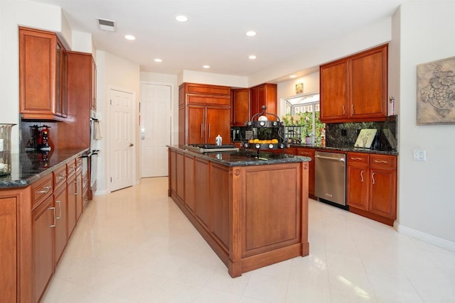 4883 Bradshaw Ct, San Diego, CA 92130 - kitchen featuring stainless steel appliances, a center island, backsplash, dark stone countertops, and recessed lighting