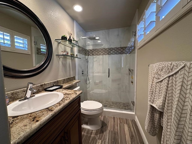 4883 Bradshaw Ct, San Diego, CA 92130 - bathroom featuring a shower stall, wood finished floors, vanity, and a textured wall