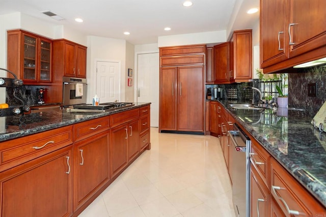 4883 Bradshaw Ct, San Diego, CA 92130 - kitchen with stainless steel appliances, decorative backsplash, recessed lighting, glass insert cabinets, and dark stone counters