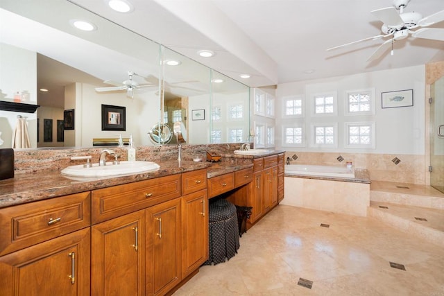4883 Bradshaw Ct, San Diego, CA 92130 - bathroom with a ceiling fan, a bath, double vanity, a shower stall, and recessed lighting