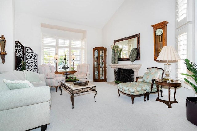 4883 Bradshaw Ct, San Diego, CA 92130 - carpeted living area featuring high vaulted ceiling, healthy amount of natural light, and a fireplace with raised hearth