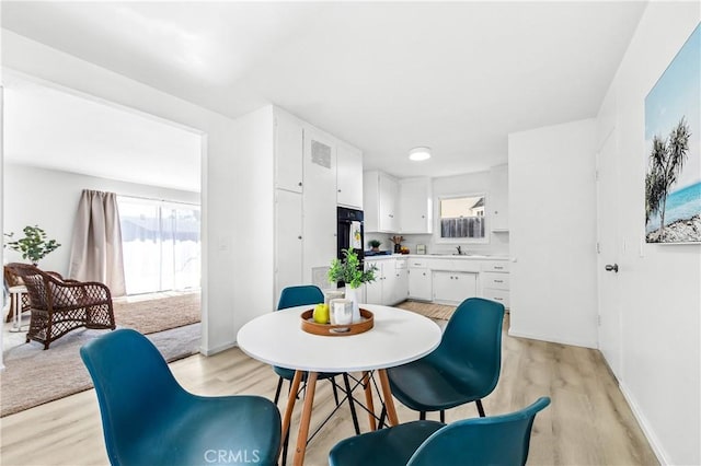 16271 Fairway Ln, Huntington Beach, CA 92649 - dining area featuring light wood-style flooring and baseboards