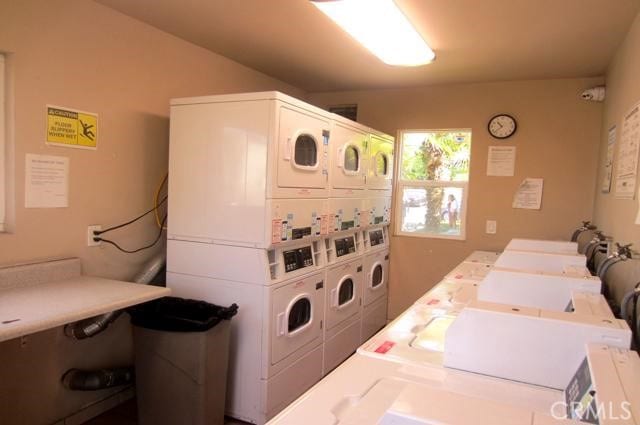 1386 E Madison Ave Unit 21, El Cajon, CA 92021 - shared laundry featuring stacked washer and clothes dryer and washing machine and clothes dryer