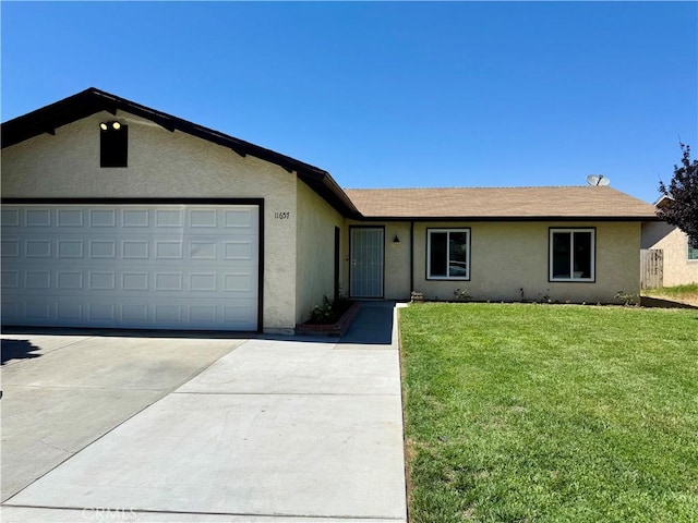 11657 Queensborough St, Riverside, CA 92503 - ranch-style home featuring concrete driveway, stucco siding, a front lawn, and a garage