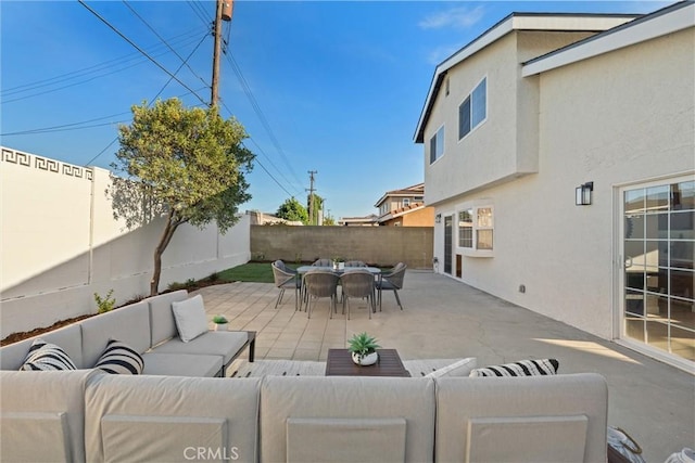 7372 Brian Ln, La Palma, CA 90623 - fenced backyard with an outdoor hangout area, outdoor dining space, and a patio