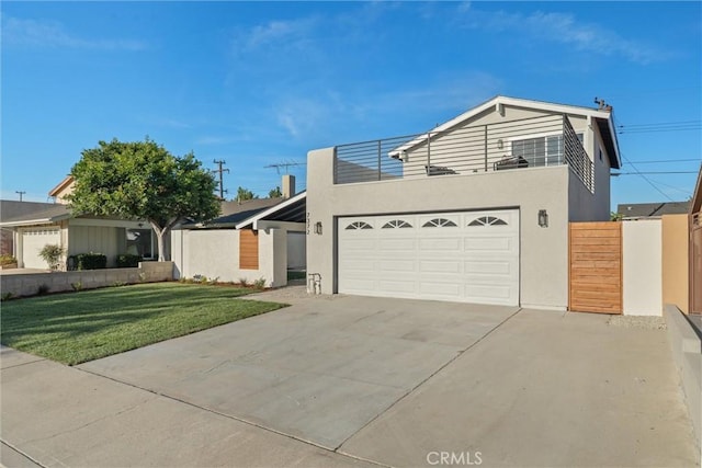 7372 Brian Ln, La Palma, CA 90623 - view of front of house featuring concrete driveway, a balcony, stucco siding, and an attached garage