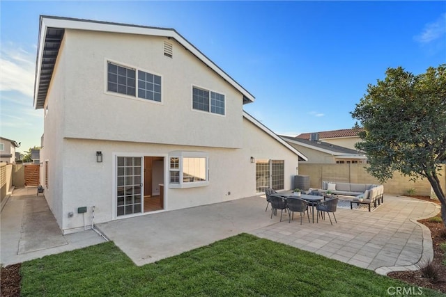 7372 Brian Ln, La Palma, CA 90623 - rear view of property featuring an outdoor hangout area, stucco siding, a fenced backyard, and a patio area