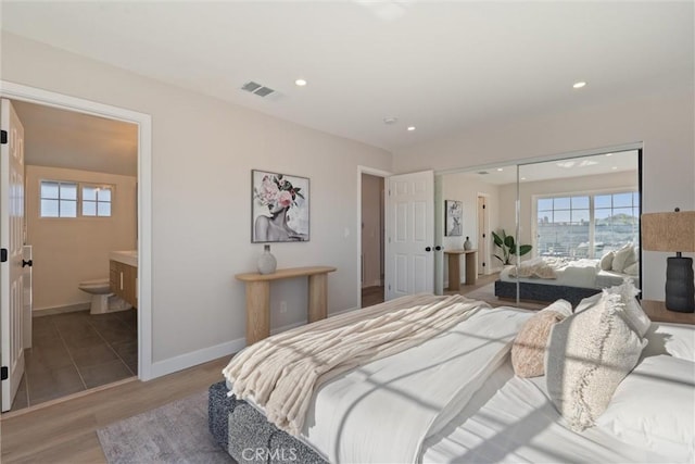 7372 Brian Ln, La Palma, CA 90623 - bedroom featuring light wood-type flooring, recessed lighting, a closet, and connected bathroom