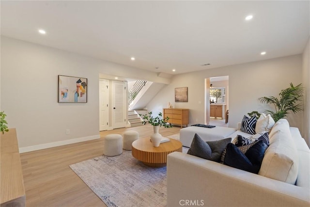 7372 Brian Ln, La Palma, CA 90623 - living area with light wood finished floors, recessed lighting, and stairway