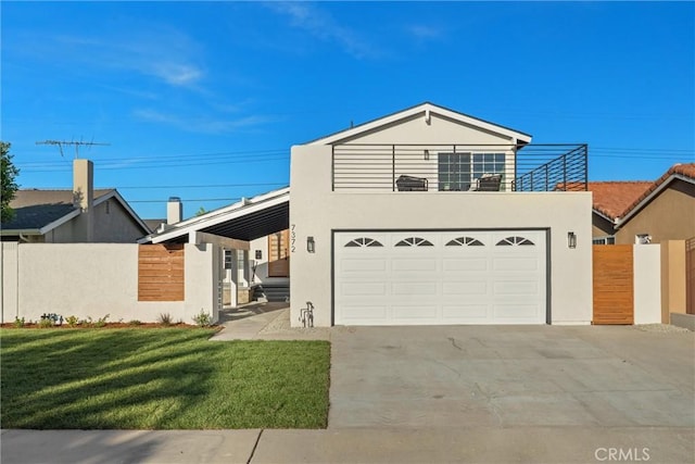 7372 Brian Ln, La Palma, CA 90623 - view of front of house with concrete driveway, stucco siding, a garage, and a balcony
