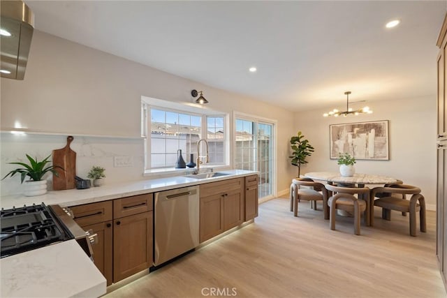 7372 Brian Ln, La Palma, CA 90623 - kitchen featuring stainless steel dishwasher, light wood-style floors, stove, recessed lighting, and light countertops