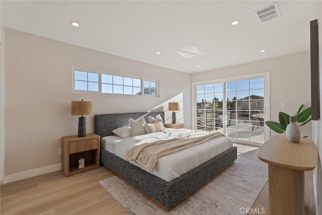 7372 Brian Ln, La Palma, CA 90623 - bedroom with multiple windows, access to exterior, light wood-style flooring, and recessed lighting