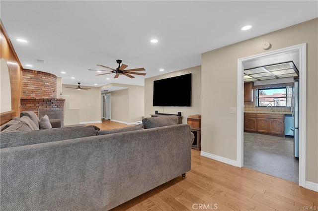19055 Seaforth St, Hesperia, CA 92345 - living area with light wood finished floors, recessed lighting, and a ceiling fan