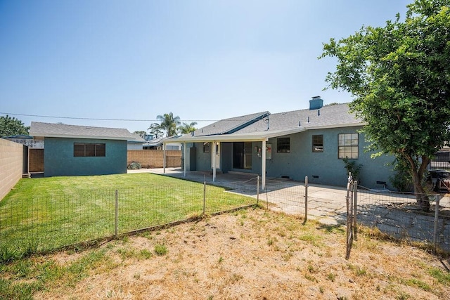 309 N Leland Ave, West Covina, CA 91790 - rear view of property featuring a patio area, a fenced backyard, stucco siding, and a chimney