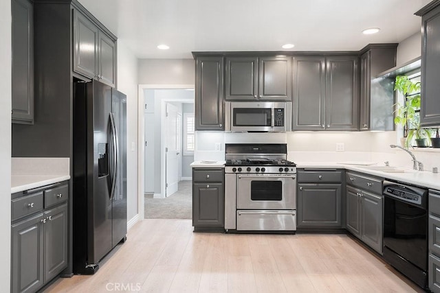 309 N Leland Ave, West Covina, CA 91790 - kitchen with stainless steel appliances, gray cabinets, light wood-type flooring, light countertops, and recessed lighting