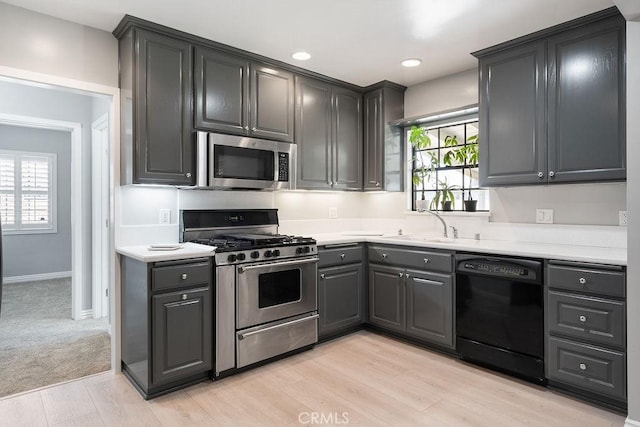 309 N Leland Ave, West Covina, CA 91790 - kitchen featuring stainless steel appliances, light wood-style flooring, light countertops, gray cabinets, and recessed lighting