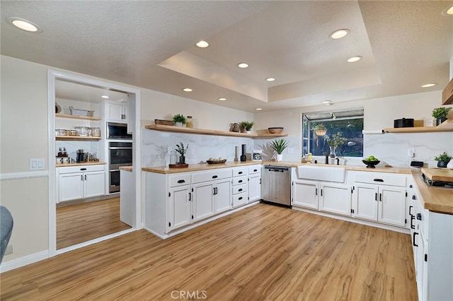 40630 Calle Torcida, Temecula, CA 92591 - kitchen with open shelves, appliances with stainless steel finishes, light wood finished floors, white cabinets, and recessed lighting
