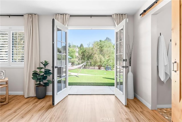 40630 Calle Torcida, Temecula, CA 92591 - doorway featuring wood finished floors and a barn door