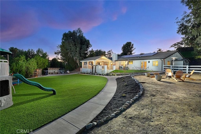 40630 Calle Torcida, Temecula, CA 92591 - yard at dusk featuring a fire pit and a playground