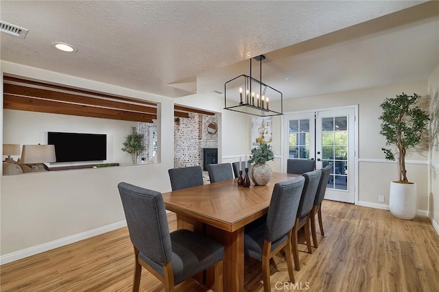 40630 Calle Torcida, Temecula, CA 92591 - dining space with light wood-type flooring, french doors, recessed lighting, a textured ceiling, and a chandelier