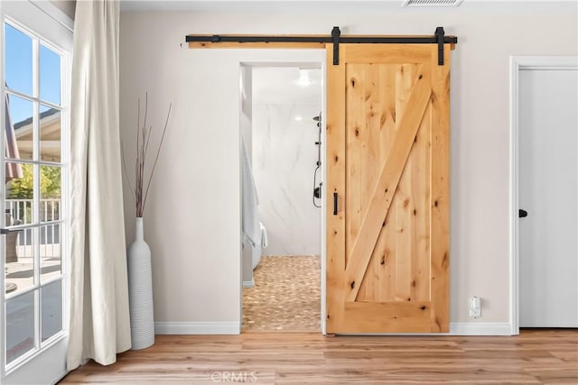 40630 Calle Torcida, Temecula, CA 92591 - hall featuring a barn door and wood finished floors