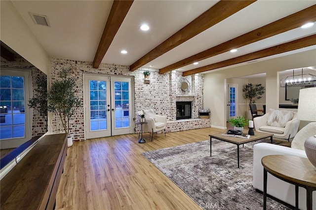 40630 Calle Torcida, Temecula, CA 92591 - living area with french doors, wood finished floors, a chandelier, recessed lighting, and brick wall