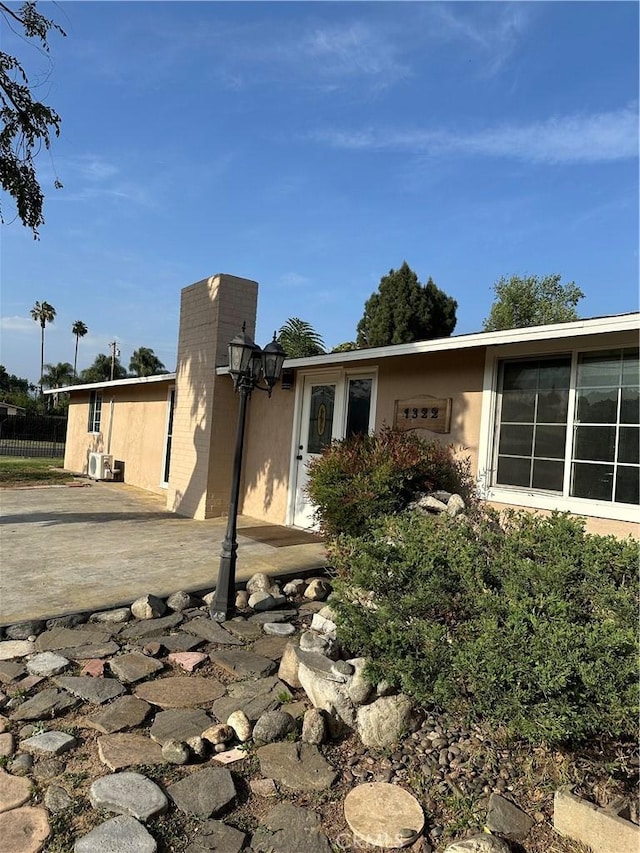 1322 S Walnut Ave, West Covina, CA 91790 - view of side of home featuring stucco siding