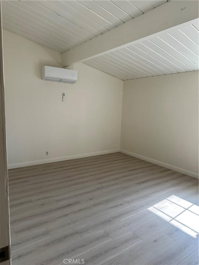 1322 S Walnut Ave, West Covina, CA 91790 - spare room featuring a wall mounted AC and light wood-style flooring