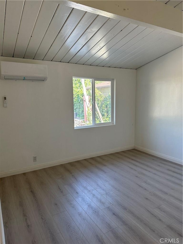 1322 S Walnut Ave, West Covina, CA 91790 - spare room with a wall unit AC, wood finished floors, vaulted ceiling, and wood ceiling