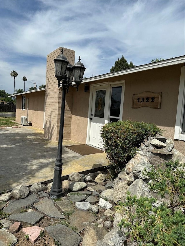 1322 S Walnut Ave, West Covina, CA 91790 - view of home's exterior with stucco siding and a patio